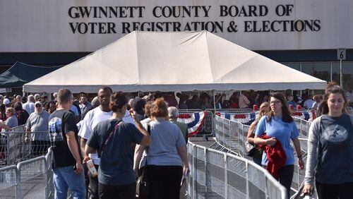 Early voters wait outside Gwinnett County Board of Voter Registration and Elections in Lawrenceville on Wednesday, October 26, 2016. HYOSUB SHIN / HSHIN@AJC.COM