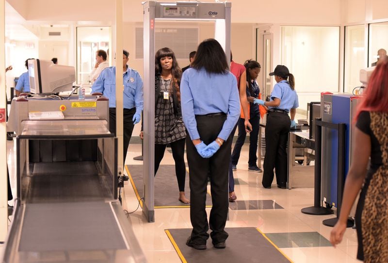 SEPTEMBER 3, 2015 ATLANTA Airport employees pass through the screening checkpoint. Hartsfield-Jackson Atlanta International Airport officials are implementing a new security screening process for employees. The new screening procedures soft launched this week and full screening begins September 8, 2015. OVER 40, 000 employees work in the secured areas of the airport. KENT D. JOHNSON/KDJOHNSON@AJC.COM