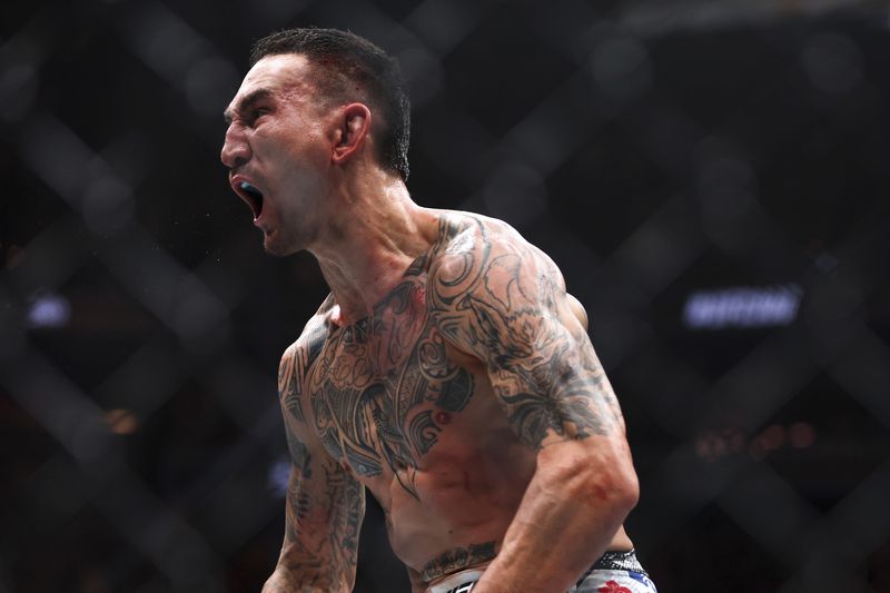 Max Holloway celebrates after knocking out Justin Gaethje during a UFC 300 mixed martial arts lightweight bout Saturday, April 13, 2024, in Las Vegas. (Ellen Schmidt/Las Vegas Review-Journal via AP)