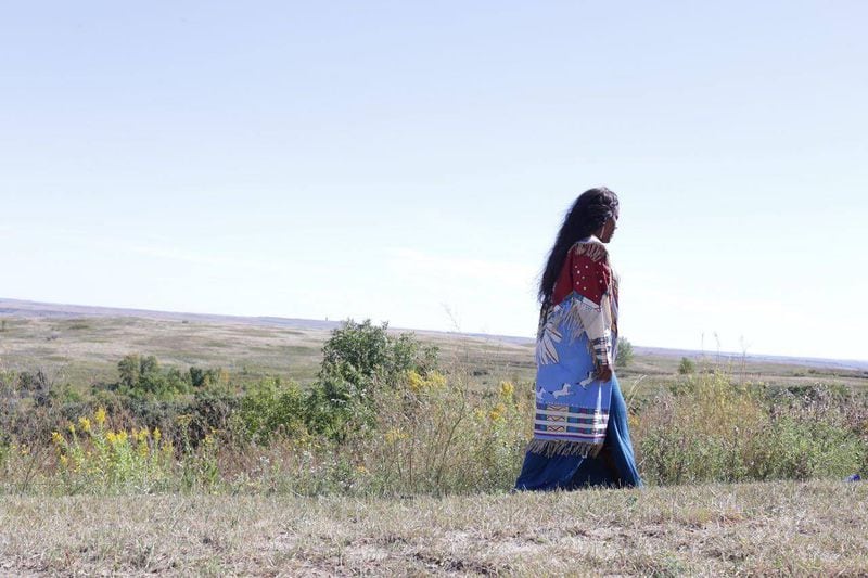 Yonasda Lonewolf walks on the land of her family on the Pine Ridge reservation in South Dakota in 2016. Courtesy of Yonasda Lonewolf