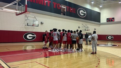 Georgia basketball players huddle at their first practice of the 2023-24 season at the Stegeman Coliseum Training Facility.