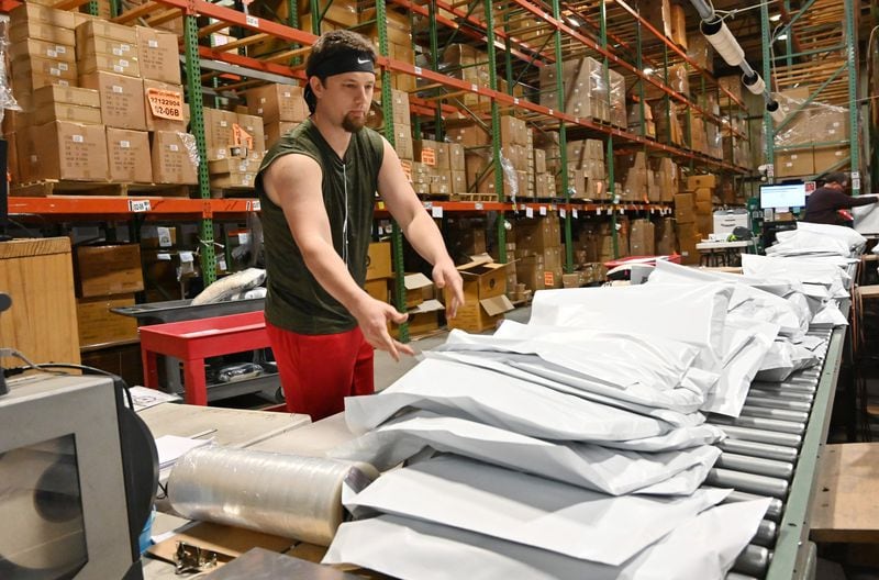 March 26, 2020 Marietta - Brad Dalton and other employees are busy working to fulfill orders at their warehouse at Glory Haus in Marietta on Thursday, March 26, 2020. Glory Haus, a Cobb County-based home decor business, suffered a massive slump in order cancellations from companies that sell their products due to the novel coronavirus. The business on Monday was featured on Good Morning America’s Deals & Steals from small businesses segments. Since then, the business has seen a sudden, drastic turnaround. Since Monday’s segment, it has received 10,000 orders for its products. (Hyosub Shin / Hyosub.Shin@ajc.com)