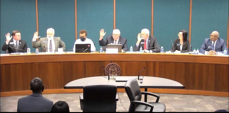 Four Republican state senators, including Clint Dixon (left), vote in committee for a bill to change how school board members are voted on in Gwinnett County. (Courtesy of Georgia Legislative video)