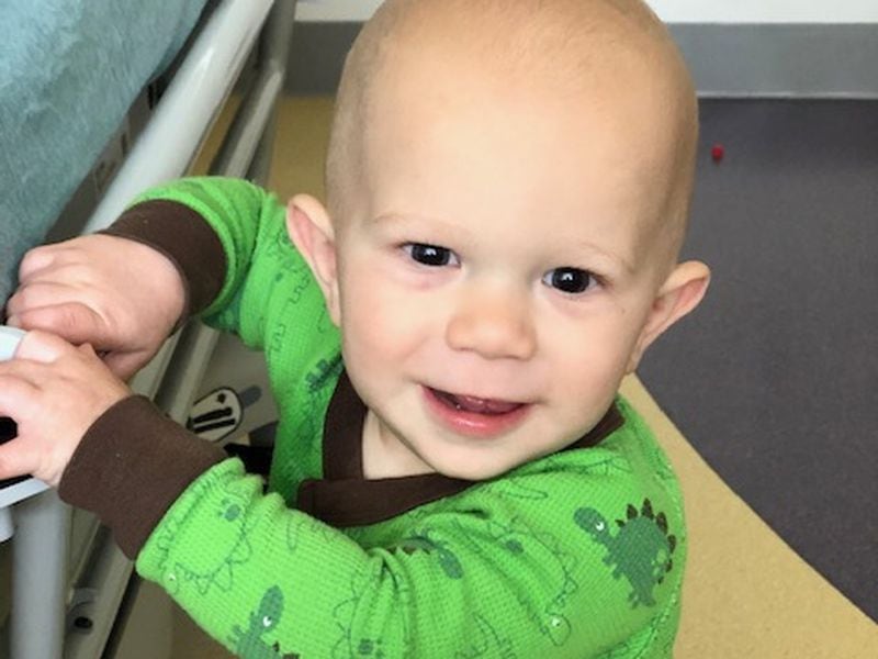 Carter Rush smiles big at his last chemotherapy treatment for retinoblastoma.