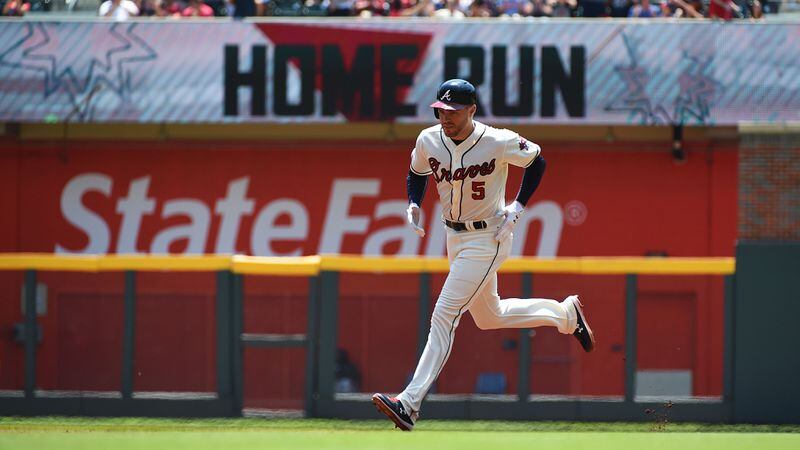 Freddie Freeman trots the bases after hitting a home run in the first inning against the Colorado Rockies April 28, 2019, at SunTrust Park in Atlanta.
