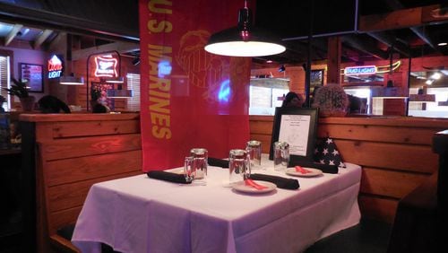 This table at the Texas Roadhhouse restaurant in Chattahooga has been set in honor of the slain servicemen. Photo: Jennifer Brett