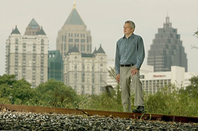 The caption on this 2004 file photo read: "Ryan Gravel looks over the railroad line near Piedmont Park that he would like to see turn into a trolley or street car system for MARTA connecting intown neighborhoods."