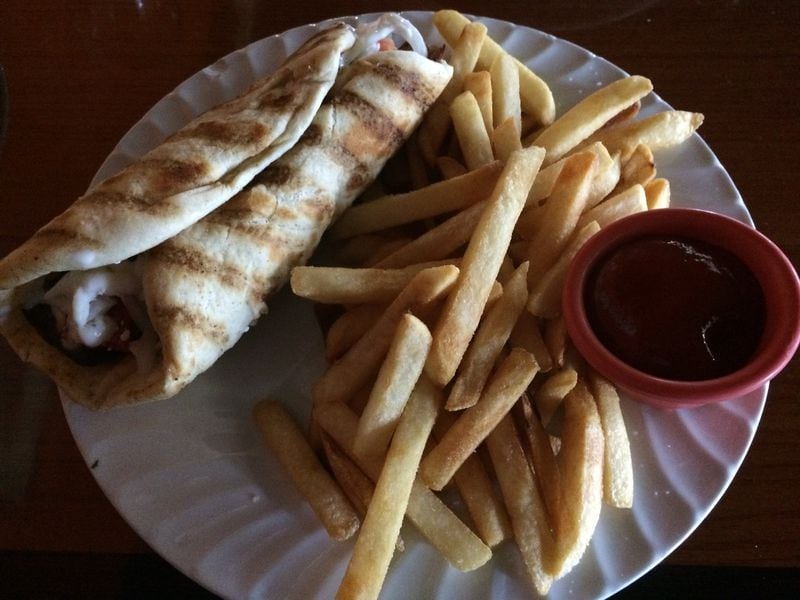At $6.49, the pita wrap with fries is a good bargain at Euro Gourmet Grill in Lawrenceville. CONTRIBUTED BY WENDELL BROCK