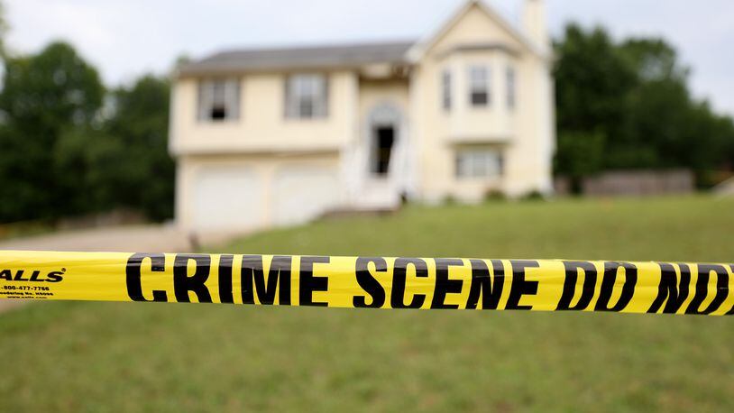 062722 Rockmart, Ga..: Crime scene tape is shown at the home on Woodwind Drive where three children died, Friday in Paulding County, Monday, June 27, 2022, in Rockmart, Ga.. The mother of the children, Darlene Brister, 40, is charged with two counts of malice murder following the deaths. (Jason Getz / Jason.Getz@ajc.com)