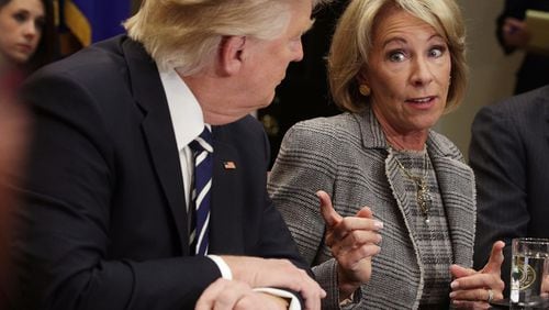 WASHINGTON, DC - FEBRUARY 14: U.S. Secretary of Education Betsy DeVos speaks as President Donald Trump listens during a parent-teacher conference listening session at the Roosevelt Room of the White House earlier this month. (Photo by Alex Wong/Getty Images)