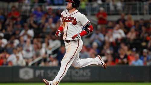 The Braves’ Josh Donaldson heads to second base after hitting a two-RBI double in the fifth inning against the Toronto Blue Jays at SunTrust Park on Tuesday night.