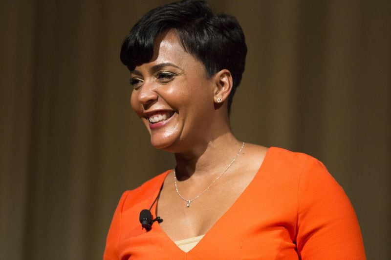 Atlanta mayoral candidate Keisha Lance Bottoms laughs during a political forum with other mayoral candidate, Mary Norwood, at the Carter Center, Tuesday, Nov. 28, 2017. ALYSSA POINTER/ALYSSA.POINTER@AJC.COM