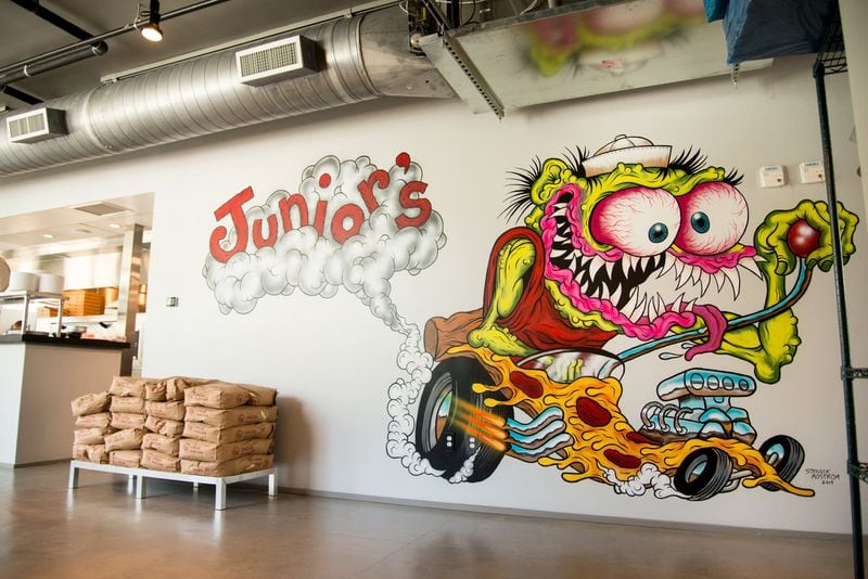 Zany, comic-book murals give Junior’s Pizza part of its charm. CONTRIBUTED BY MIA YAKEL