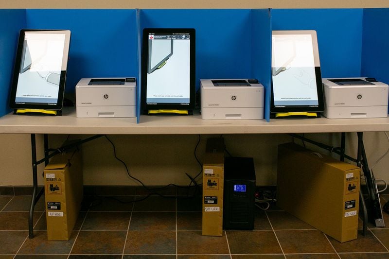 New polling machines wait to be used at the Paulding County Municipal Building in Dallas, Georgia. Paulding is one of six counties where the new machines are being tested ahead of statewide use in Georgia’s presidential primary on March 24. (Photo/Rebecca Wright for the Atlanta Journal-Constitution)