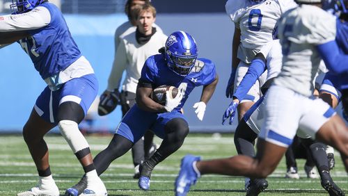 Georgia State running back CJ Beasley (4) runs with the football during the first day of spring football practice at Center Parc Stadium, Tuesday, February 13, 2024, in Atlanta. (Jason Getz / jason.getz@ajc.com)