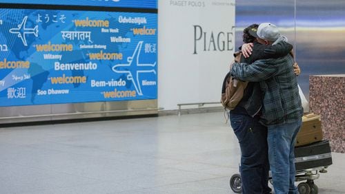 In this Feb. 5 photo Abdullah Alghazali, right, hugs his 13-year-old son, Ali Abdullah Alghazali, after the Yemeni boy stepped out of an arrival entrance at John F. Kennedy International Airport in New York. U.S. Customs and Border Protection officers will be key players in implementing President Donald Trump’s revised travel ban, affecting visitors from six mostly Muslim countries: Iran, Libya, Somalia, Sudan, Syria, and Yemen. (AP Photo/Alexander F. Yuan, File)