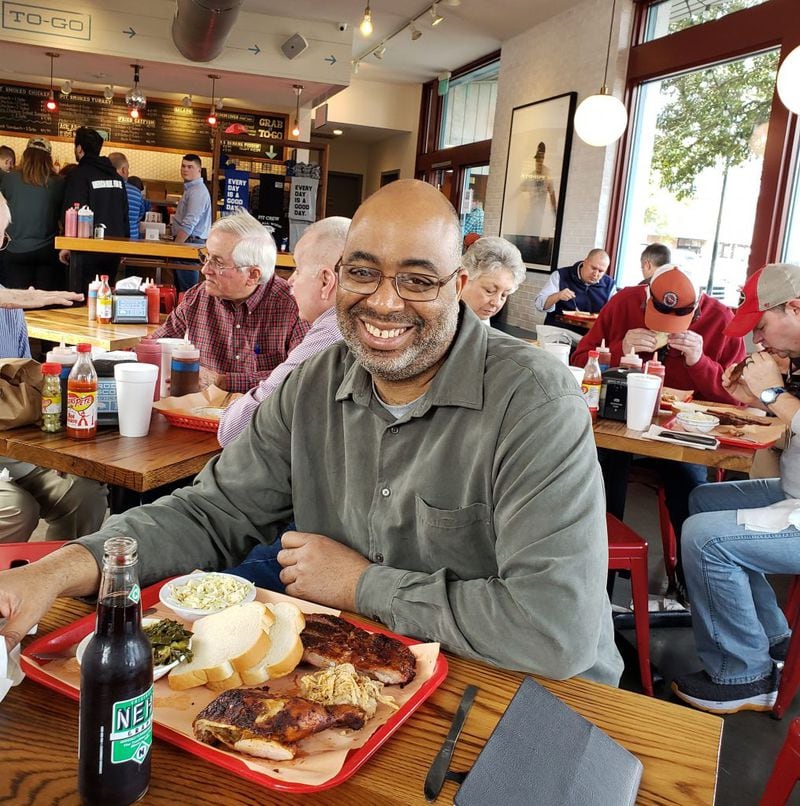 Adrian Miller, author of "Black Smoke," does some delicious research at Rodney Scott's BBQ in Charleston, S.C. (Courtesy of Adrian Miller)