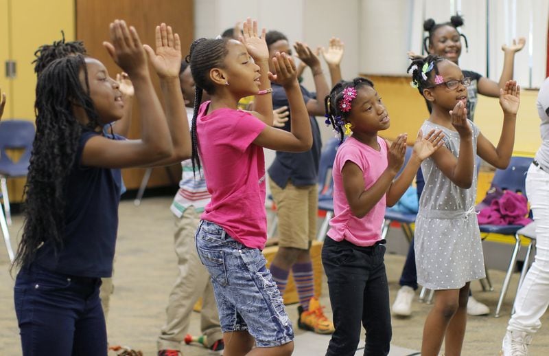 Third graders practice in Letricia Henson’s music and chorus class at Thomasville Heights Elementary School, the first school to be part of APS’ outsourcing experiment. BOB ANDRES /BANDRES@AJC.COM