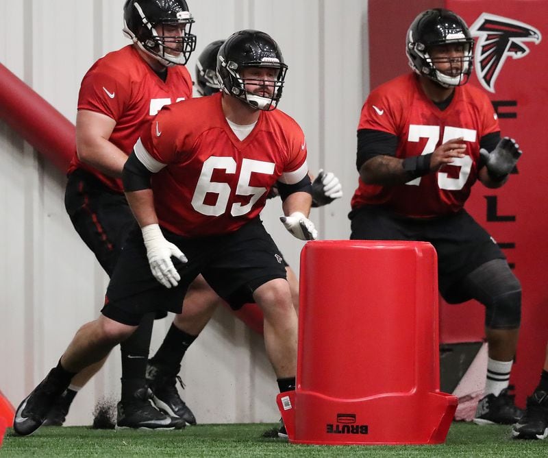May 22, 2018 Flowery Branch: Atlanta Falcons new offensive guard Brandon Fusco (left) runs a drill with guard Jamil Douglas during organized team activities on Tuesday, May 22, 2018, in Flowery Branch.   Curtis Compton/ccompton@ajc.com