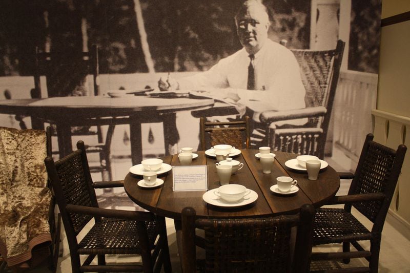 China setting and furniture on display at the FDR Memorial Museum, part of Roosevelt’s Little White House state historic site in Warm Springs, Ga. The china on display is Royal Copenhagen of Denmark. New York Gov. Franklin D. Roosevelt used these pieces while he stayed at his first cottage in Warm Springs known today as the McCarthy Cottage. HOLLY STEEL / HSTEEL@AJC.COM