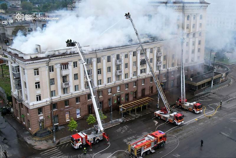 In this photo provided by the Ukrainian Emergency Service, rescuers work on the scene of a building damaged after a Russian attack in Dnipro, Ukraine, Friday, April 19, 2024. (Ukrainian Emergency Service via AP Photo)