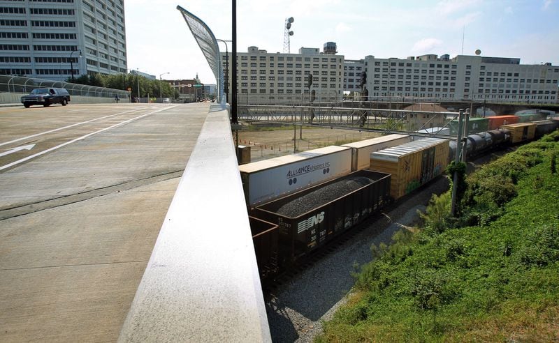 Norfolk Southern trains travels under the newly opened Mitchell Street Bridge in downtown Atlanta Thursday morning in Atlanta, Ga., August 23, 2012. AJC File Photo
