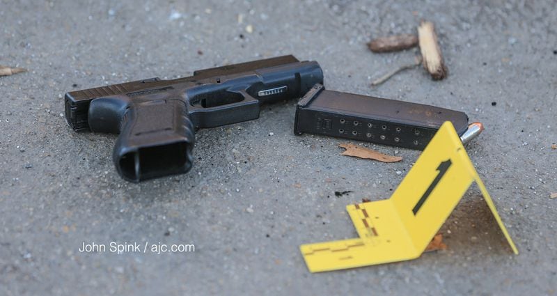 A gun was found on the shooting scene outside the Wyndham Atlanta Galleria. (JOHN SPINK / JSPINK@AJC.COM)