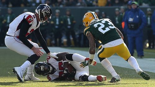 Tevin Coleman (26) of the Atlanta Falcons recovers a fumble during the first half of a game against the Green Bay Packers at Lambeau Field on December 09, 2018 in Green Bay, Wisconsin. (Photo by Dylan Buell/Getty Images)