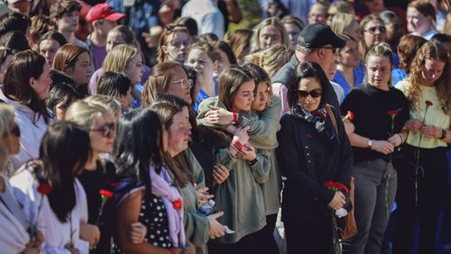 Students attend a vigil for 22-year-old Laken Riley, who was killed near the University of Georgia's intramural fields on Feb. 22. (Melissa Golden/The New York Times)