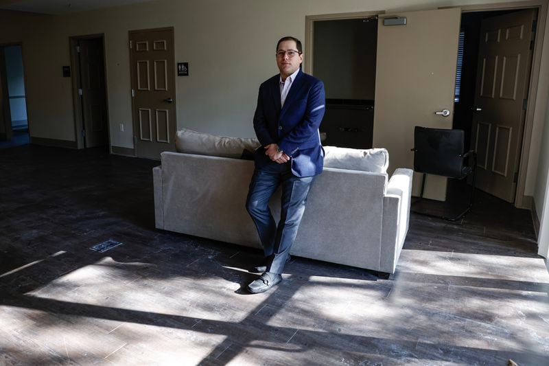 Adam Kaye says that his client has lost tens of thousands of dollars from delays, much of which has gone towards securing the property -- even though it’s sitting vacant. “I didn’t realize, at the beginning, that it was going to be such an arduous journey,” he said. (Natrice Miller/ Natrice.miller@ajc.com)