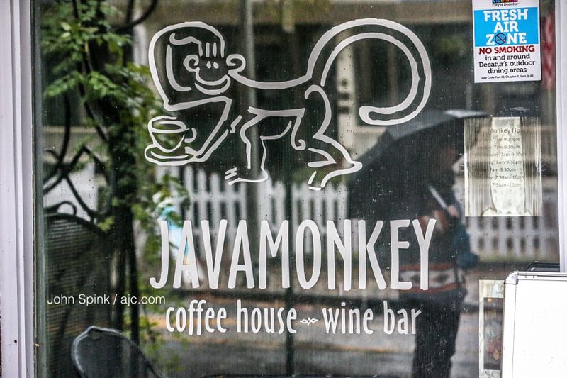 The fire damaged Java Monkey on Church Street in downtown Decatur, and two nearby businesses had smoke and water damage, fire officials said. JOHN SPINK / JSPINK@AJC.COM