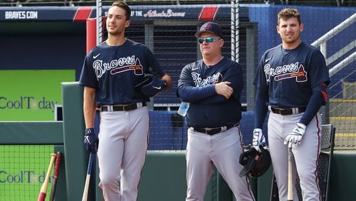 Atlanta Braves first baseman Matt Olson (from left), hitting coach Kevin Seitzer, and third baseman Austin Riley watch pitcher Dylan Lee throw live batting practice during Spring Training at CoolToday Park on Wednesday, March 16, 2022, in North Port. “Curtis Compton / AJC file”