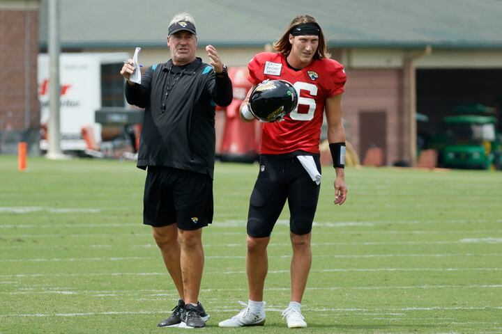 Jaguars head coach Doug Pederson gives directions to Jaguars quarterback Trevor Lawrence (16) during a joint training camp at the Falcons Practice Facility on Wednesday, August 24, 2022, in Flowery Branch, Ga.
 Miguel Martinez / miguel.martinezjimenez@ajc.com