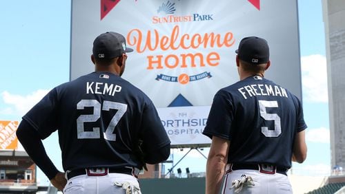 The Braves’ Matt Kemp and Freddie Freeman take in their new home before Friday night’s exhibition game against the New York Yankees at SunTrust Park. (Curtis Compton/ccompton@ajc.com)