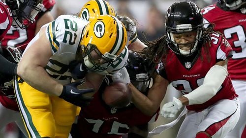 Green Bay Packers' Aaron Ripkowski fumbles the ball in the second quarter after contact with the Atlanta Falcons' Jalen Collins (right) in the NFC Championship Game at the Georgia Dome Jan. 22, 2017 in Atlanta.