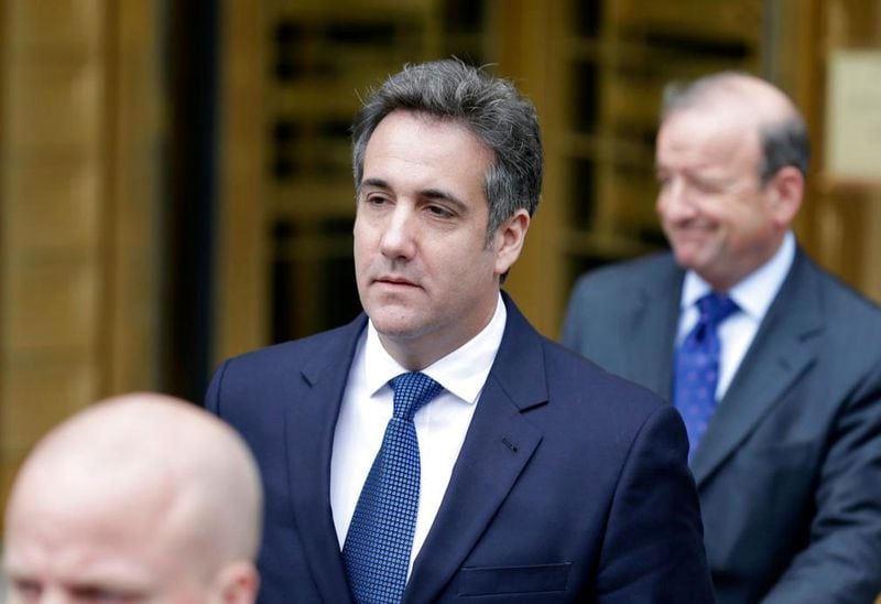Michael Cohen, center, leaves court in New York, Wednesday, May 30, 2018. A New York judge says lawyers for President Donald Trump's personal lawyer and Trump have until June 15 to make attorney-client privilege claims over data seized in April raids. (AP Photo/Seth Wenig)