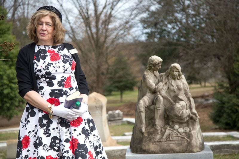 Tour guide Joan Fountain talks about the man and wife statue tombstone to her group at Oakland Cemetery during Love Stories of Oakland’s hourlong tour in Atlanta GA. February 9, 2019. STEVE SCHAEFER / SPECIAL TO THE AJC