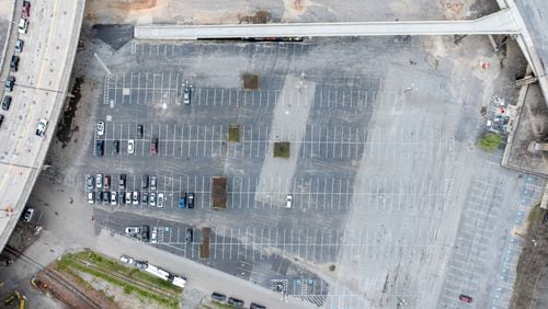A drone image shows the parking lot known as “The Gulch,” site of the planned Centennial Yards project near Mercedes-Benz Stadium in downtown Atlanta. Beneath the pavement are MARTA tunnels to work around and ancient water and sewer lines, some of the oldest in Atlanta, that need to be replaced
Miguel Martinez /miguel.martinezjimenez@ajc.com