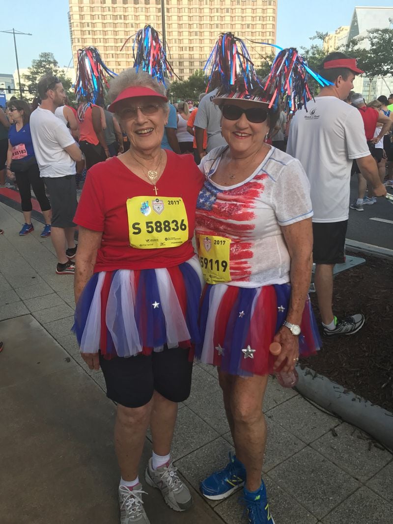 Elaine Shiver and Lynn James are running the Peachtree for their sixth and fifth year, respectively. They are dressed in honor of Shiver's daughter, who has leukemia and would normally be walking the race with them.