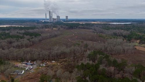 An aerial photograph shows Georgia Power’s coal-fired power plant and its ash pond (right) in Juliette. The community has spent almost 10 years battling the utility over concerns about the groundwater, which they believe to be contaminated by coal ash from nearby Plant Scherer. (Hyosub Shin / Hyosub.Shin@ajc.com)