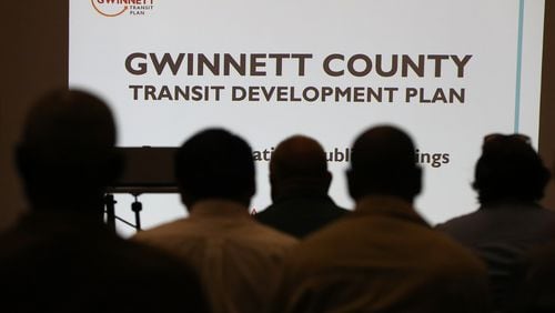 Local residents attend a Gwinnett County public open house and information session on its proposed transit plan in April. Curtis Compton,ccompton@ajc.com