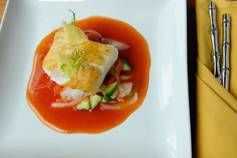 Grilled Chilean Sea Bass fillet on a bed of mixed vegetables in sweet and sour sauce. (BECKY STEIN PHOTOGRAPHY)