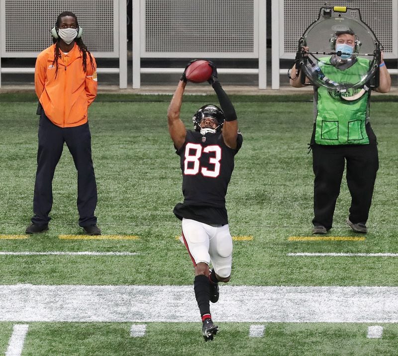 Falcons wide receiver Russell Gage goes up for a pass before diving into the end zone against the New Orleans Saints during the fourth quarter Sunday, Dec. 6, 2020, at Mercedes-Benz Stadium in Atlanta. (Curtis Compton / Curtis.Compton@ajc.com)