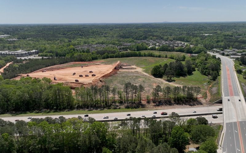 Aerial photograph shows a proposed mixed-use development and arena with the goal of bringing a NHL franchise back to metro Atlanta, along Ga. 400 (foreground L-R), Tuesday, April 18, 2023, in Alpharetta. The project, called The Gathering at South Forsyth, aims to transform roughly 100 acres along Ga. 400 into an entertainment hub centered around an 18,000-seat arena. (Hyosub Shin / Hyosub.Shin@ajc.com) 
