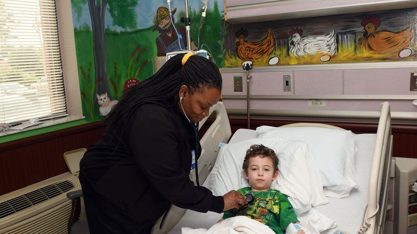 Pediatric RN Shareem Wrease examines Trevor Rozier, 4, of Eastman, at Dodge County Hospital in Eastman, Georgia on September 21, 2017. This hospital benefits from several federal funding programs for hospitals that are rural, or treat the poor, or treat working class kids -- all of which are slated to see cuts or expire Sept. 30 if they're not renewed. (Rebecca Breyer)