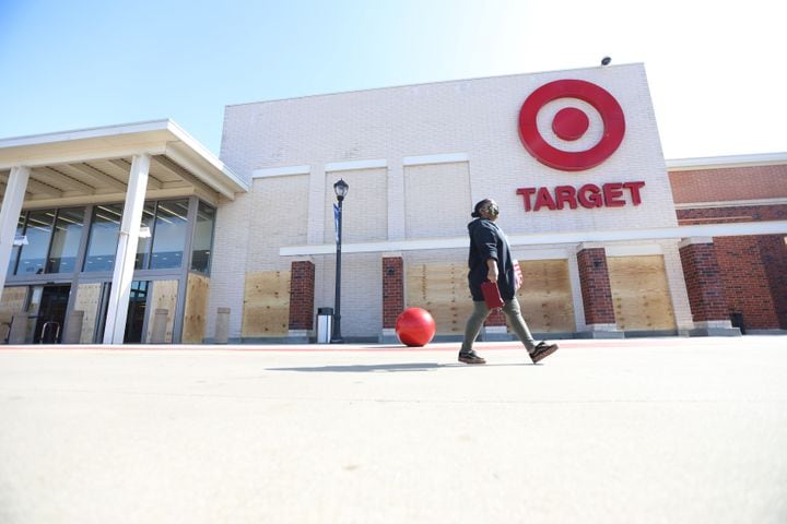 In Atlanta, a Target Store on Edgewood Retail Center protected the entrance and windows with plywood, but a sign welcomes shoppers. Business around town are boarding up windows amid fears of unrest  related to the elections on Tuesday, Nov. 3, 2020, 
Miguel Martinez for The Atlanta Journal-Constitution