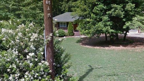 Sandy Springs is spending $400,000 to buy this house at 6018 Kayron Drive for the eventual widening of Hammond Drive. Courtesy of the City of Sandy Springs
