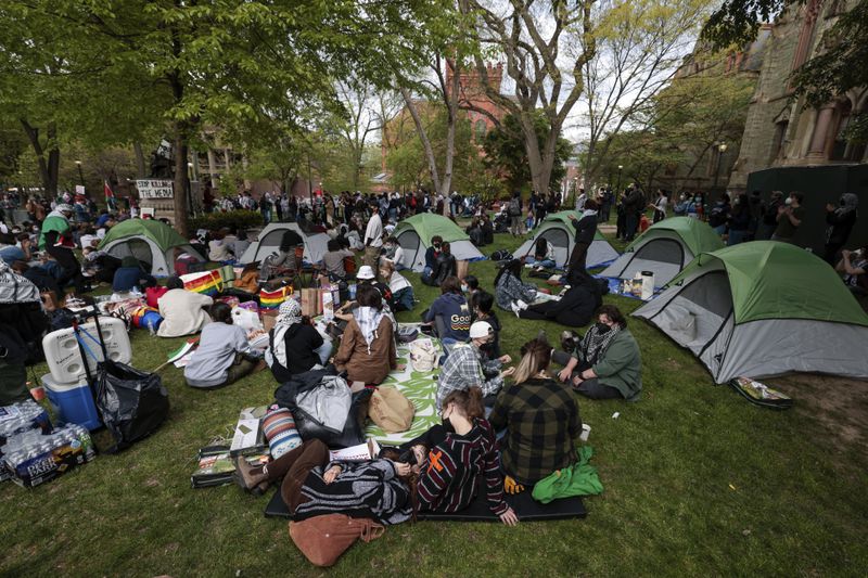People take part in a pro-Palestinian protest on Penn's campus in Philadelphia on Thursday, April 25, 2024. (Elizabeth Robertson/The Philadelphia Inquirer via AP)