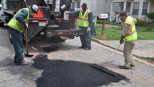 As the low bidder, Bartow Paving Company, Inc. will be paid $421,293 to resurface four streets in Kennesaw. AJC file photo