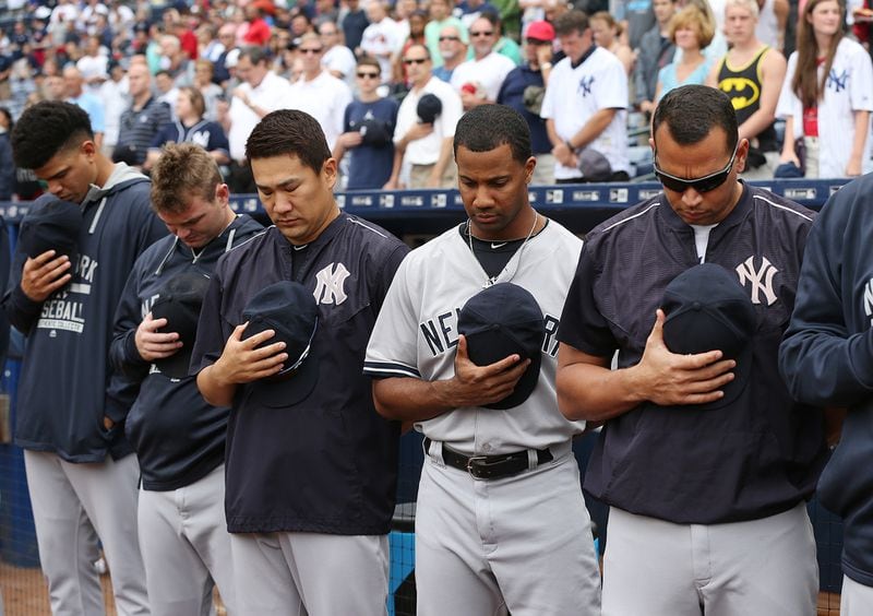 On August 30, 2015, in Atlanta, Alex Rodriguez (right) and the rest of the New York Yankees joined in a moment of silence for baseball fan Gregory Murrey, 60, Alpharetta, who fell to his death from the top deck during the game on Aug. 29, 2015, between the Braves and the Yankees. Curtis Compton / ccompton@ajc.com